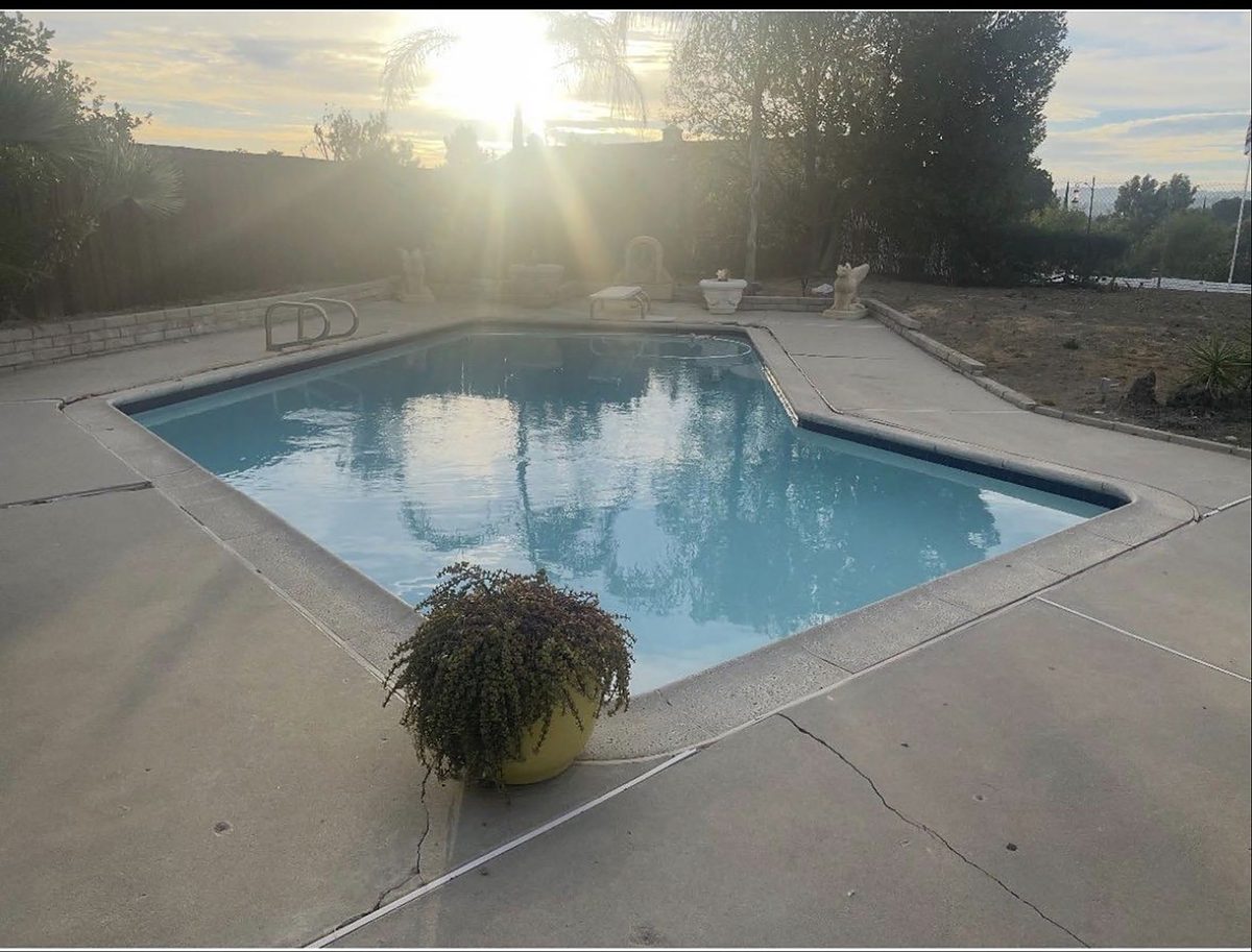 Matt and Elizabeth of ASJEM Pools maintain this backyard pool