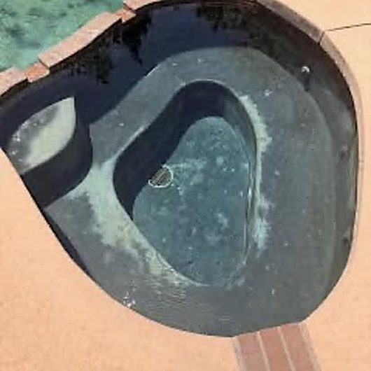 Dark, murky spa water before ASJEM Pools cleaning