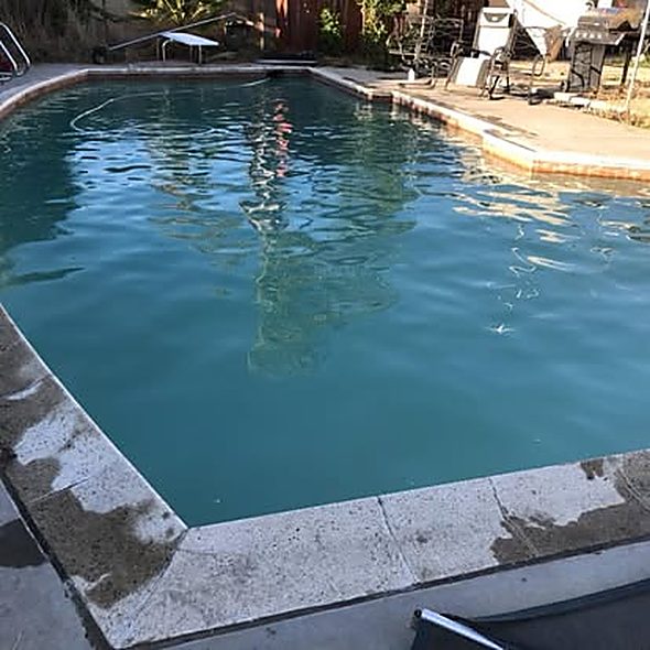 Clear blue rectangular pool after ASJEM Pools cleaning